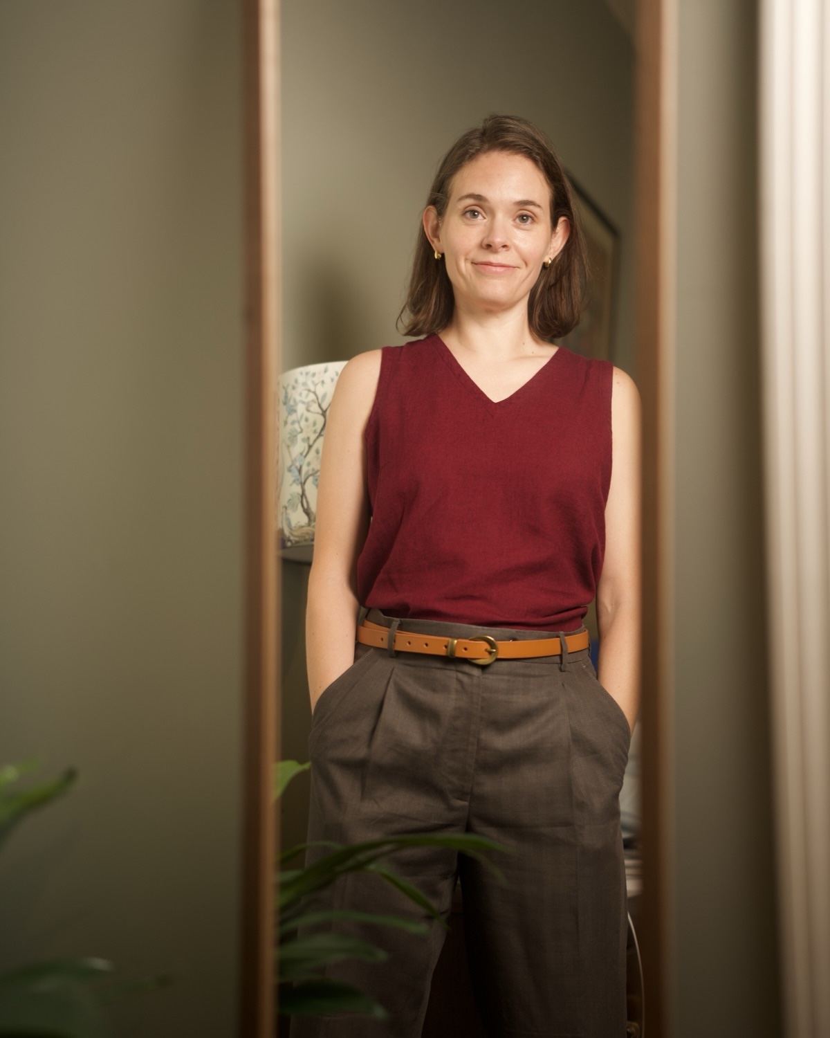 Lee at a full-length mirror